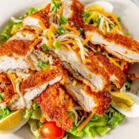 Crispy Chicken Salad · Breaded chicken tenders with mixed greens, cucumbers, hard-boiled egg, and SFS fill in dress...