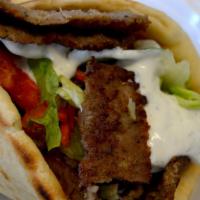Greek Gyro Sandwich · Grilled chicken or beef gyro, shredded lettuce, tomato, red onion, tzatziki and fries.