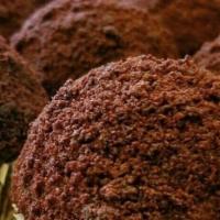 Blackout Cupcake · Chocolate cupcake filled and topped with velvety chocolate pudding coated in chocolate cake ...