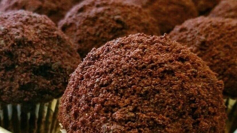 Blackout Cupcake · Chocolate cupcake filled and topped with velvety chocolate pudding coated in chocolate cake crumbs.

1 cupcake.