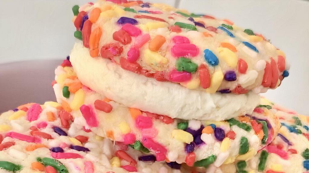 Birthday Cake Cookie · Buttah cookies coated in fun rainbow sprinkles sandwiched between vanilla American buttercream!

1 cookie.