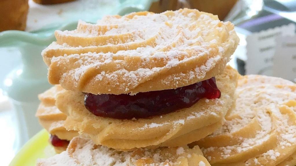 Raspberry Buttah Swirl Cookie · Two vanilla buttah swirl cookies sandwiched between thick raspberry jam.

1 cookie.