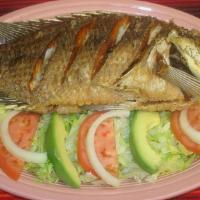 Mojarra Frita · Whole fried tilapia. Served with salad.