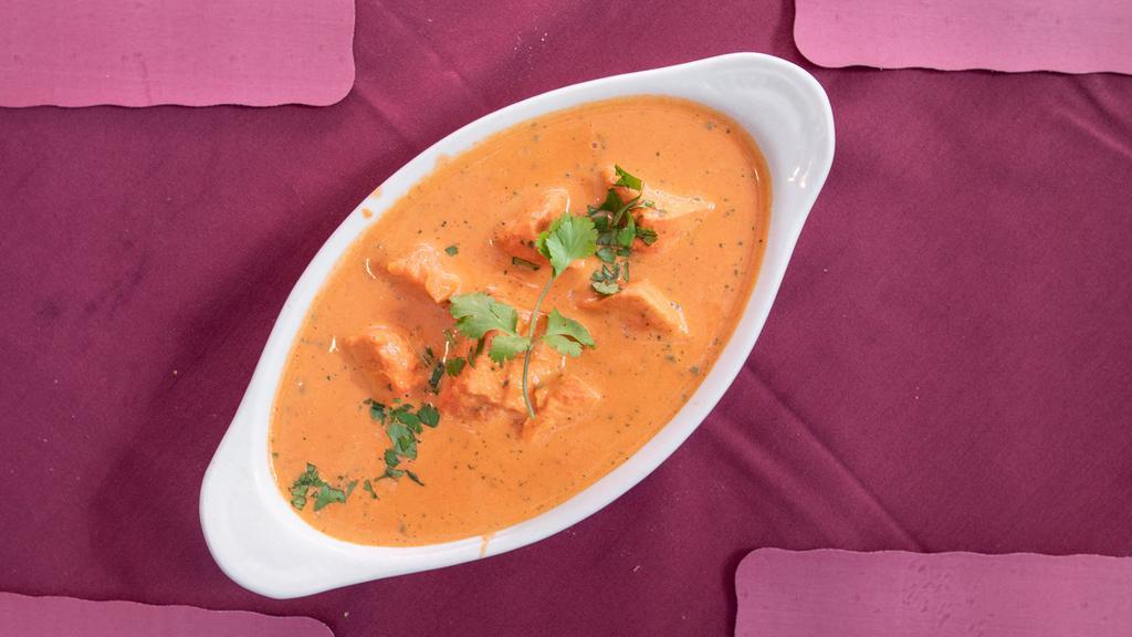 Chicken Tikka Masala · Tender boneless chunks of chicken, broiled in the tandoor, then cooked in a rich tomato, onion, and butter sauce.