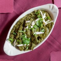 Saag Paneer · Fresh homemade Indian cheese cubes gently cooked with garden spinach, coriander, and mild sp...