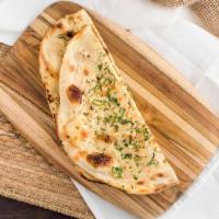 Garlic Naan · A popular aromatic naan topped with fresh chopped garlic and spices.