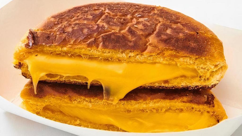 Kid’S Grilled Cheese. · American cheese on a potato roll.