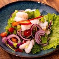 Yum Ruam Mitr (Seafood Salad) · Gluten-Free. Shrimp, squid, mussel, onion, scallion, cilantro, tomato and celery with Thai c...