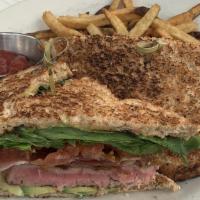 Wicked Tuna Sandwich · Sesami-wasabi mayonnaise, avocado, bacon, tomato, and lettuce. On toasted whole wheat bread,...