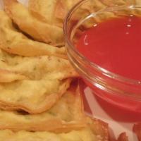 Fried Cheese Wonton (Crab Rangoon) / 芝士云吞 · 8 pieces and serve with sweet and sour sauce on the side.