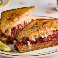 Corned Beef Reuben · Slow cooked corned beef, sauerkraut, swiss cheese, and russian dressing on our caraway rye b...