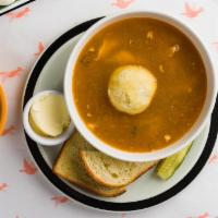 Matzo Ball Soup · Roasted Bone Broth, Shredded Chicken + Veggies. Served with a Pickle and House Challah