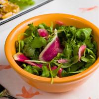 Lil Salad · Side salad - arugula, radishes, and charred lemon vinaigrette.