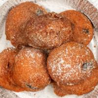 Fried Oreos · Flaky crusted Oreos with a sprinkle of powdered sugar a.