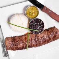 Churrasco · Grilled skirt steak with chimichurri salsa. Served with black beans and white rice.