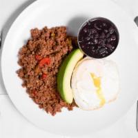Picadillo Cua Cua · Ground prime sirloin sautéed with onions, peppers, tomatoes, raisins, and olives. Topped wit...