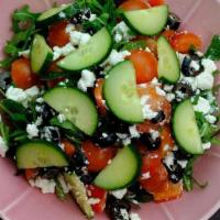 Greek Salad · Arugula, Black Olives, Cucumber, Cherry Tomatoes, Red Pepper, Feta Cheese.