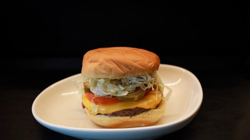 Crif Burger · Pat lafrieda beef, american cheese, crif sauce, lettuce, pickle, tomato.