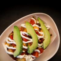 Nacho Tots · Chili, avocado, sour cream, cheese whiz, pickled jalapeno, diced onion, tomato.