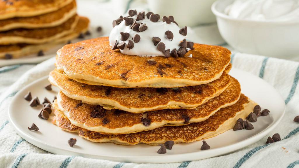 Chocolate Chip Buttermilk Pancakes · 3 perfectly fluffy chocolate chip pancakes, served with a side of butter and syrup.