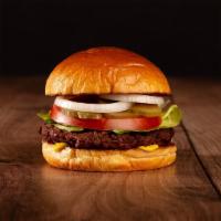 The Beyond Burger · Beyond Burger patty, lettuce, tomato, onion, pickles, and stone ground dijon on a brioche bun.