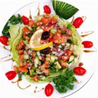 Mediterranean Salad · Diced tomatoes, cucumbers, bell peppers, onions, parsley, sumac, pomegranate sauce, and chef...