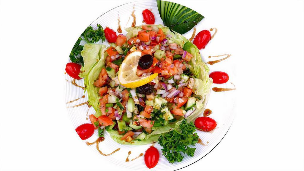 Mediterranean Salad · Diced tomatoes, cucumbers, bell peppers, onions, parsley, sumac, pomegranate sauce, and chef lemon sauce.