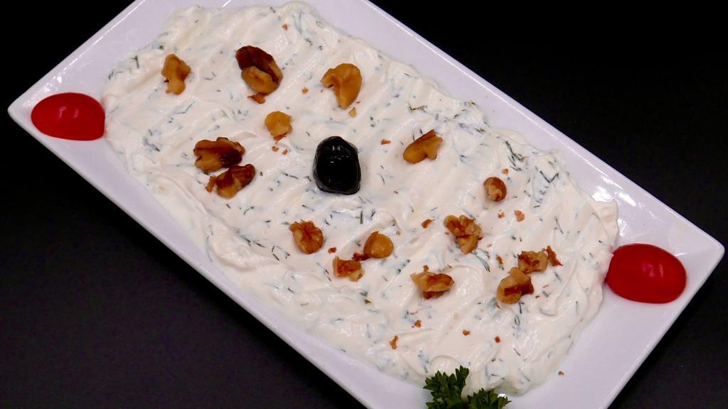 Lebni · Thick garlic labne yogurt with walnuts, dill, and olive oil.