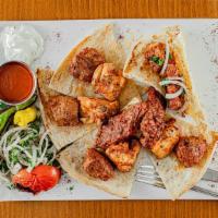 Mix Grill · Grilled skewer, lamb and chicken gyro, lamb shish, chicken shish and a lamb chop, grilled to...