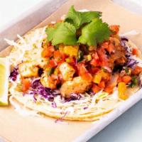Grilled Salmon Taco · Gluten-free. Cabbage, grilled salmon, pineapple salsa, and cilantro.