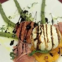 Burrata Cheese · With prosciutto, heirloom tomatoes and balsamic reduction.