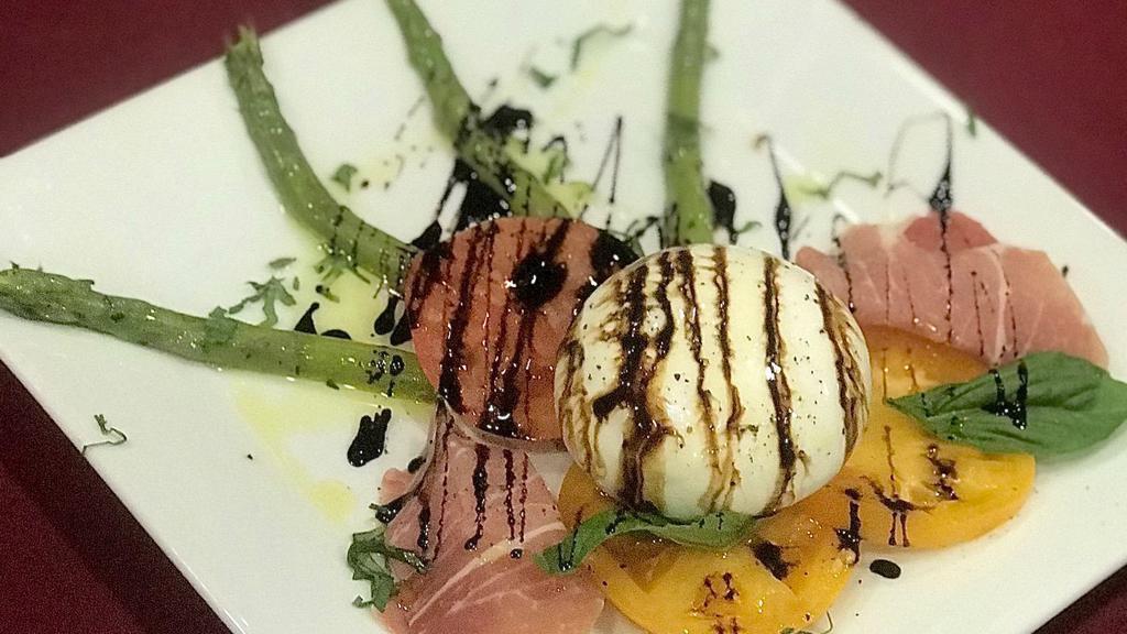 Burrata Cheese · With prosciutto, heirloom tomatoes and balsamic reduction.
