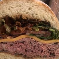 Toasted Rare Grass Fed Roast Beef Sandwich · Vermont sharp cheddar, hickory smoked bacon, leafy lettuce, red onion, tomato and peter luge...