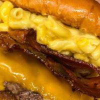 Mac Burger · Cheddar burger topped with our creamy mac n cheese, bacon, sauteed onions, and BBQ sauce