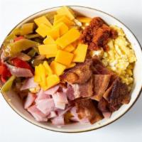 Meaty Scrambowl · Scrambled eggs with tater tots, bacon, sausage, chorizo, cheddar cheese, grilled onions and ...