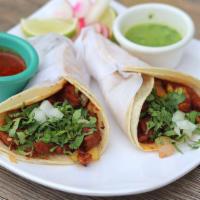Birria Tacos  · 2 tacos with beef Birria chopped with onion, cilantro and melted cheese