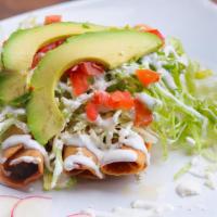 Flautas · Crispy tacos topped with lettuce, tomatoes, fresh avocado, sour cream, and a sprinkle of che...