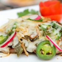 Bistec Millear · Grilled steak with sauteed jalapenos, cactus, onions and melted oaxaca cheese on top. Served...