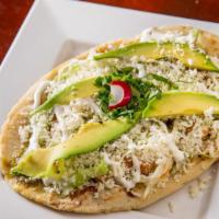 Huaraches · Fresh homemade tortillas stuffed with refried beans,  salsa verde, queso fresco, avocado, so...