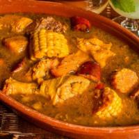 Sancocho (Spanish Harlem Stew) · Pork, green plaintains, chicken, beef, malanga and corn. Served with rice only.