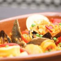 Que Rico Paella · Shrimp, mussels, clams, scallops and squid served with saffron rice only.