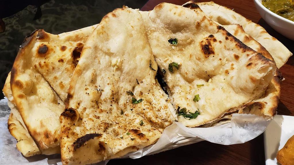 Plain Naan · Vegetarian. Soft, leavened white flour bread.