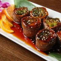 Beef Negimaki · Thinly sliced beef rolled with scallion in teriyaki sauce.