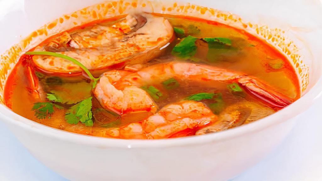 Tom Yum Goong Soup · Shrimp with Thai famous hot and sour lemongrass soup. Spicy.