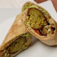 Vegetarian Falafel Wrap · Vegetarian Falafel Wrap with Shredded Lettuce, Tomato, Thin Sliced Red Onion and a Spicy Chi...