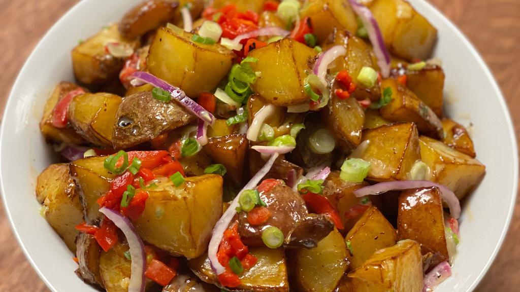 World Famous Warm Roasted Potato Salad (8Oz) · Roasted Potato Salad tossed with a Sweet Onion Vinaigrette, Red Onion, Scallion and Roasted Red Peppers