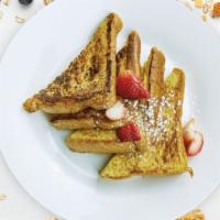 The French Toast · Fresh bread battered in egg, milk, and cinnamon cooked until spongy and golden brown. Served...
