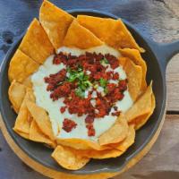 Choriqueso W/ Chips · Melted mozzarella cheese loaded with Mexican pork chorizo, onions, and cilantro, served with...