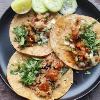 Carnitas Tacos (3) · Seasoned pork skin cooked gently in lard, wrapped with a warm 6