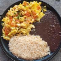 A La Mexicana · A simple and delicious combination of scrambled eggs cooked with onions, tomatoes, green chi...